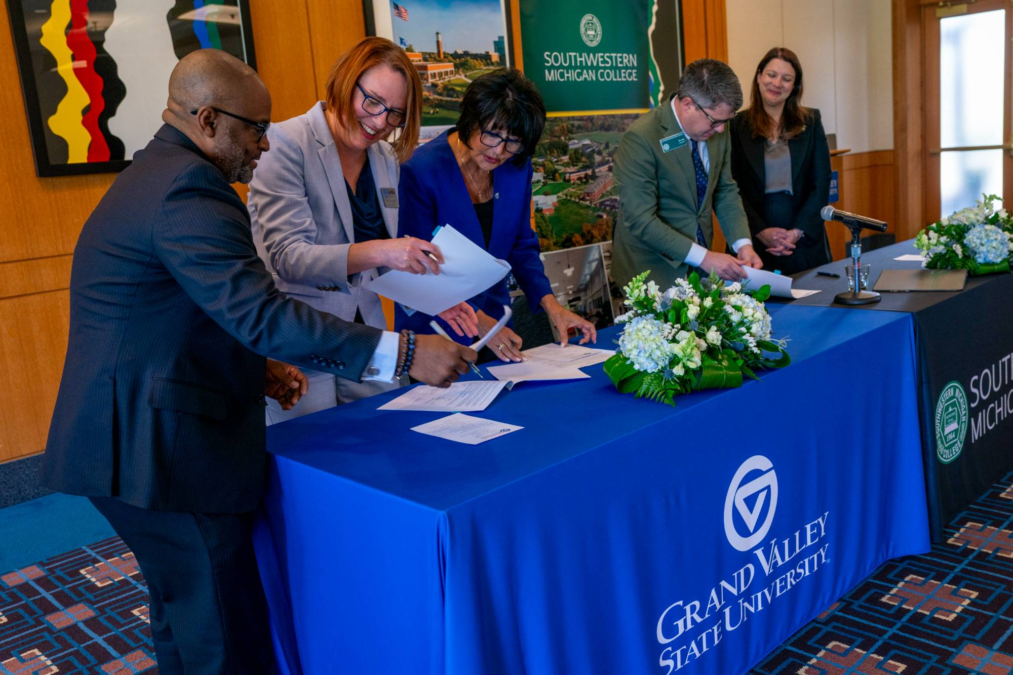Southwestern Michigan College and GVSU representatives signing an agreement